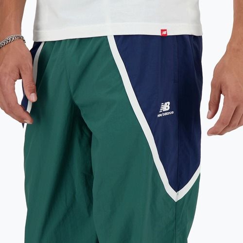 Pánske teplákové nohavice New Balance Hoops Woven team forest green