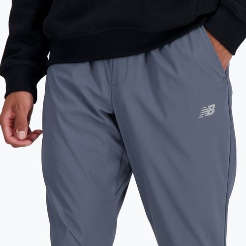 Pánske nohavice New Balance AC Stretch Woven 29 Inch graphite