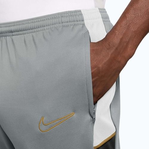 Pánske tréningové nohavice Nike Academy Dri-Fit light smoke grey/white/black/metallic gold