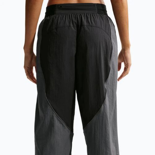 Dámske bežecké nohavice Nike Swift UV Repel Mid-Rise black/iron grey