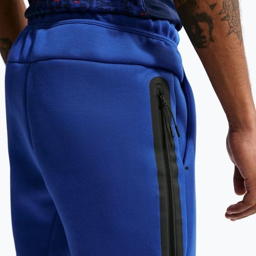 Pánske futbalové nohavice Nike FFF Tech Fleece Joggers game royal/metallic copper