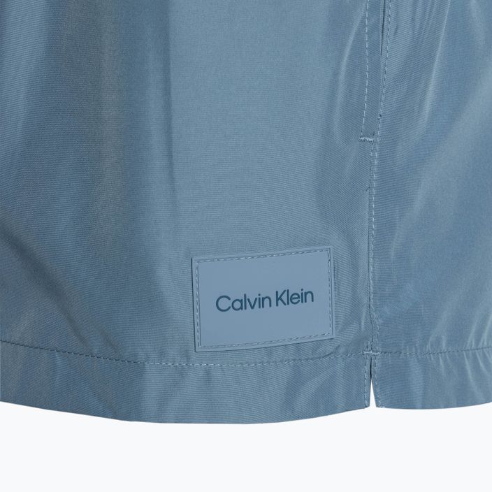 Calvin Klein Pánske krátke plavecké šortky s dvojitým pásom tlmenej azurovej farby 3