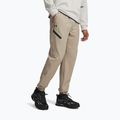 Pánske tréningové nohavice Under Armour Unstoppable Joggers city khaki/black