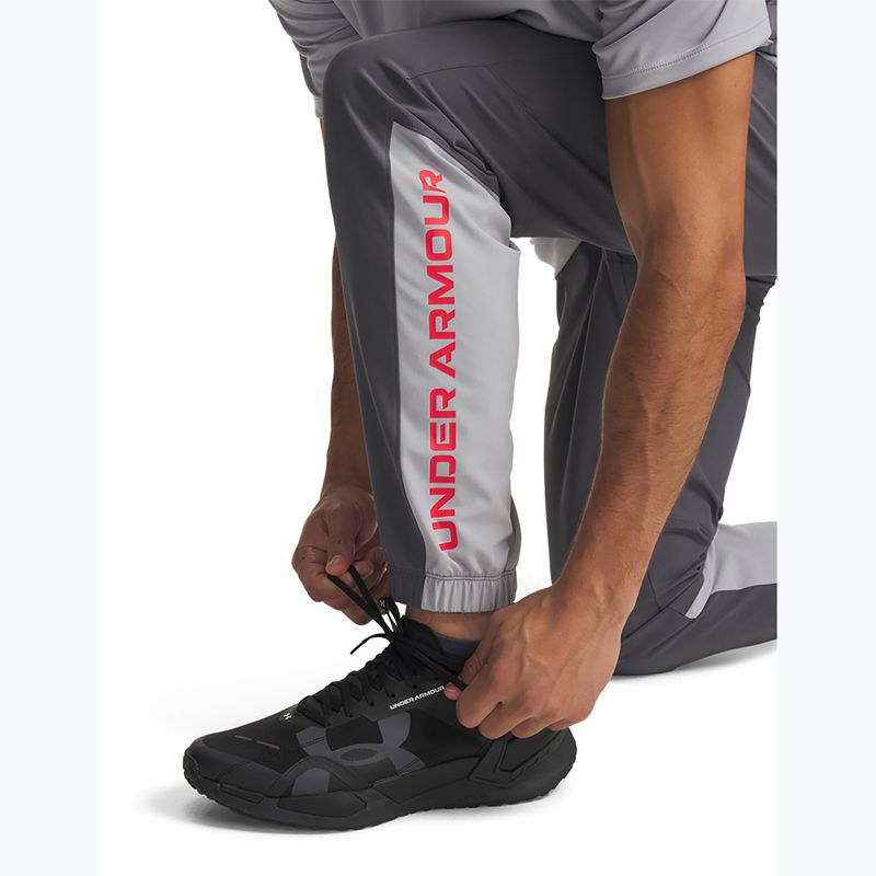 Pánske tréningové nohavice Under Armour Tech Utility Woven Pants castlerock/mod gray/racer red 5