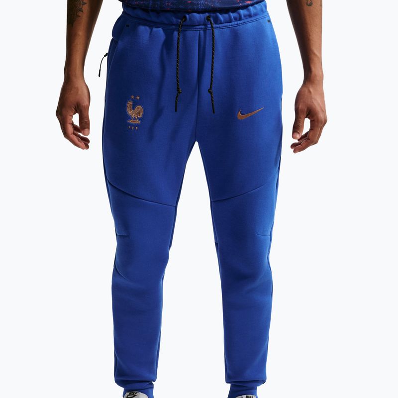 Pánske futbalové nohavice Nike FFF Tech Fleece Joggers game royal/metallic copper