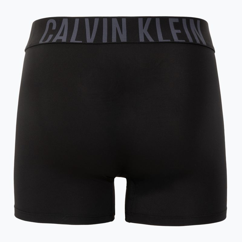 Boxerky Calvin Klein 000NB3612A4W8 Brief 3 pairs black w/ombre blue logo/black w/c 3