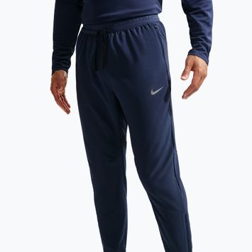 Pánske bežecké nohavice Nike Stride Dri-Fit Woven midnight navy