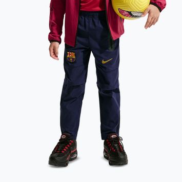 Detské futbalové nohavice Nike FC Barcelona Tech Woven blackened blue/black/mineral yellow